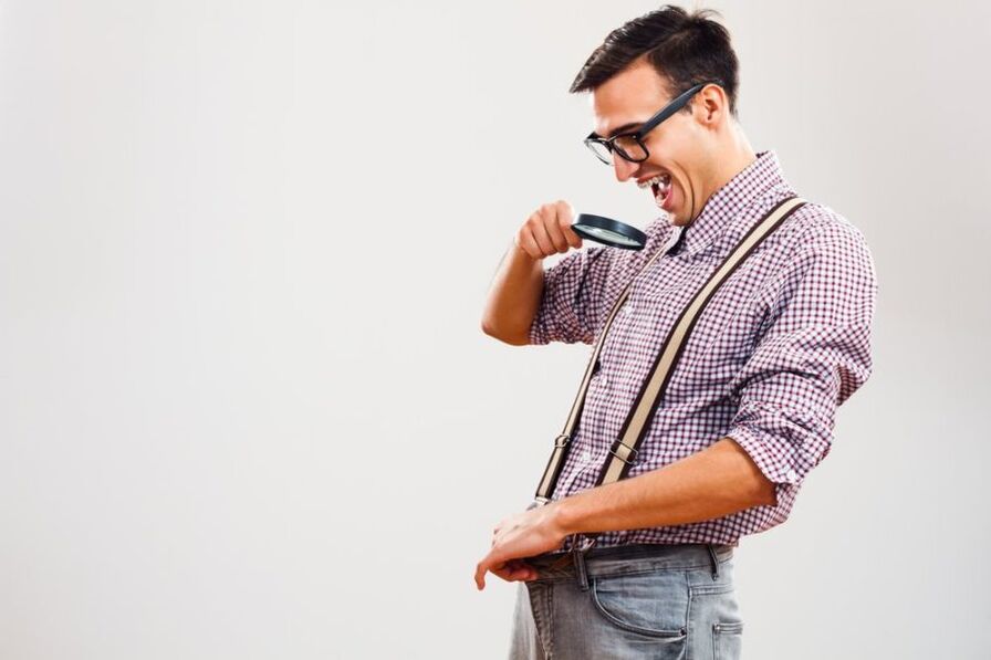 A man looks at a member through a magnifying glass